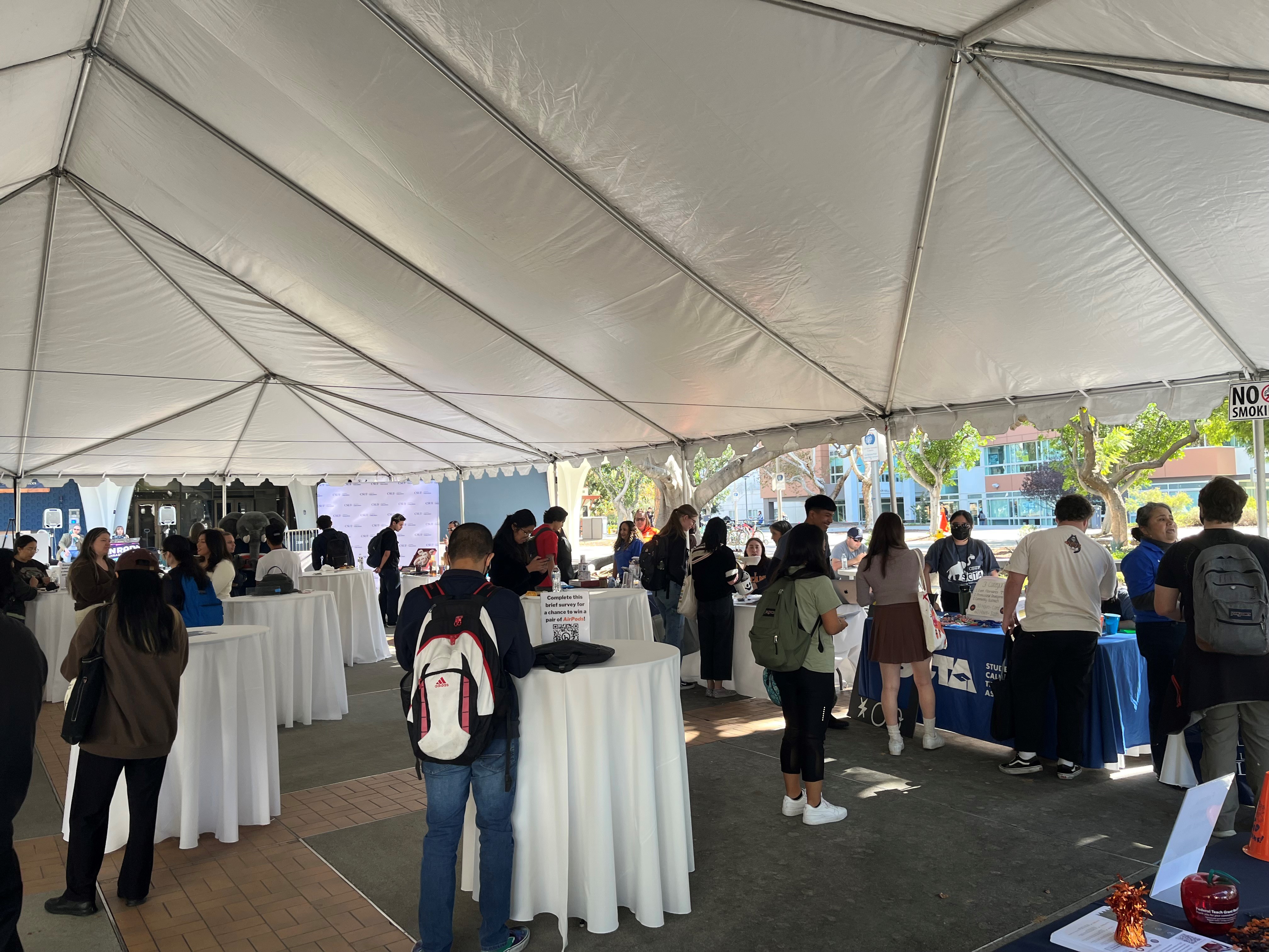 Inside Expo, cocktail tables and students