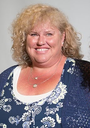 Dr. Megan Tommerup smiling in a profile showing her head and shoulders
