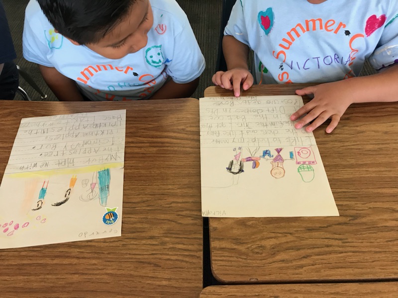 children working on a writing assignmet