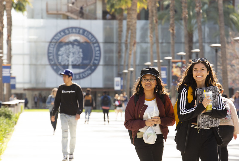 Students walking and smiling at Calstate university Fullerton